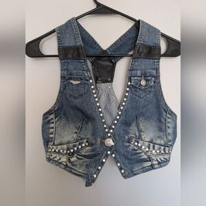 2009 - Denim cropped aviator vest, with pleather accents & bling embelishements.